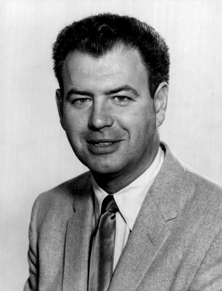 Black-and-white portrait of Nelson Riddle in a suit and tie