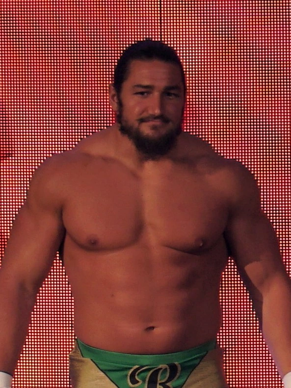 Riddick Moss, professional wrestler, standing on stage in wrestling gear.